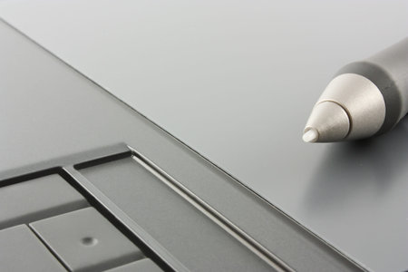 Graphic tablet with a featherの写真素材