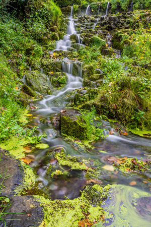 Little waterfall on a stream of water.の写真素材