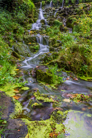 Waterfall on a stream of water (Garrotxa province, Catalonia, Spain)の写真素材