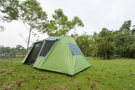 Tent camping near riverの写真素材