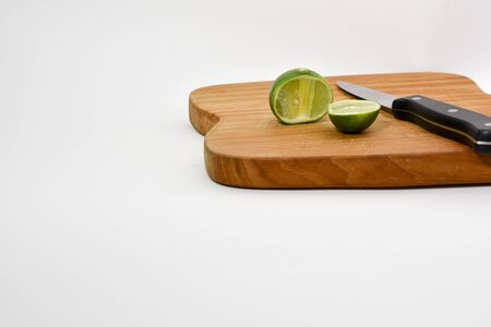 Lime slices on cutting wood boardの写真素材