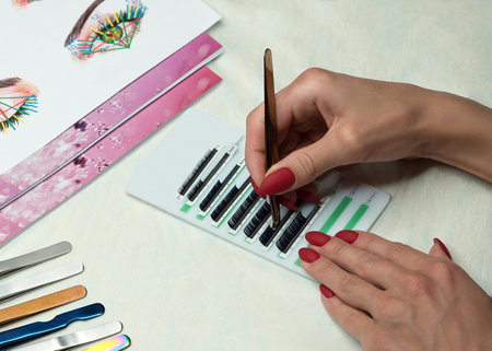 Equipment of eyelash extension, basic tuition. Tweezers, paste lashes. Beauty and service concept