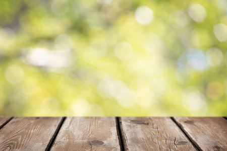 Natural spring and summer background. Wooden empty table top for food or organic product, soft focus...