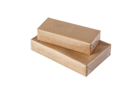 Two boxes wrapped in kraft paper of different sizes, basis for the product, isolated on white.