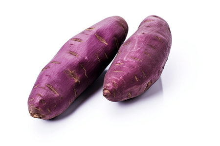 Sweet potato on a white background. Purple potato organic. Ai generative.の素材