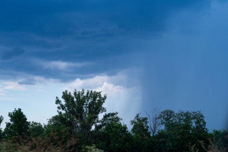 Storm front with rain and blue sky.Weather, Sky with rain clouds, it's raining.