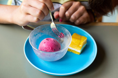 Yellow dessert on a blue plate.