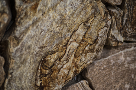 Natural stone of brown color, a piece of a wall from a natural stone. Background of natural stone.Stone texture.の写真素材