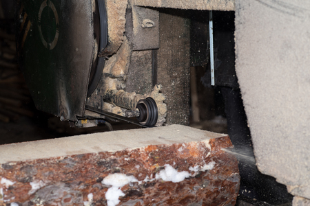 Cutting logs on the boards. In the winter process a tree.Wood processing.の写真素材