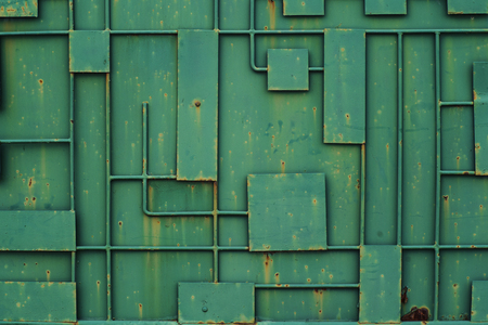 Green iron fence .Full Frame Background of Metal Door Frame Pattern.Green iron fence with a pattern of geometric lines of metal.の写真素材