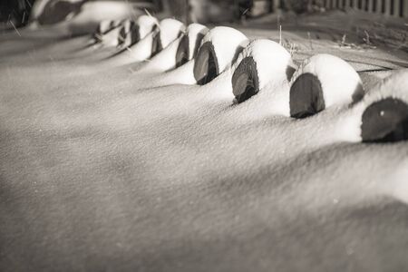 Winter landscape. Border of car wheels.Winter road and trees covered with snow.の写真素材