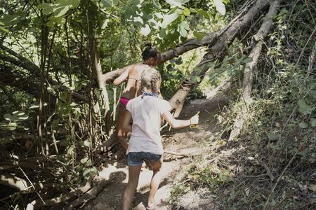 A blue river in Albania called the Blue Eye.Children walk along the path to the Blue River in Albania called the Blue Eye.The Blue eye in the south of Albania, close to Saranda and Gjirokaster. This natural water spring .の写真素材