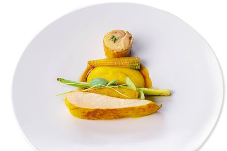 Cooked chicken breast with corn puree and sauce.Culinary masterpiece of chicken breast.の写真素材