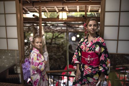 European girl in kimano clothes at a Japanese restaurant in Japan in Kyoto.Traditional Japanese tea ceremony .の写真素材