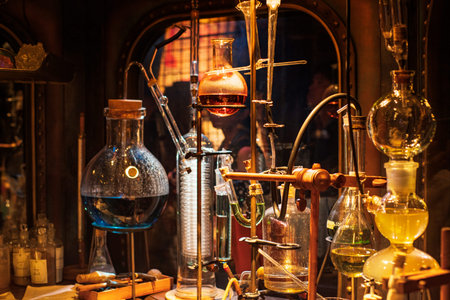 Chemical flasks on black background,glass figured bottles for chemical reactions.