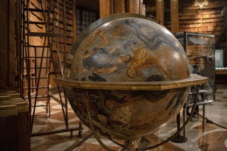 6.10.2019 Vienna,Austria .View of vintage globe. Interior of Austrian National Library old baroque library of Hapsburg empire located in Hofburg Palace.のeditorial素材