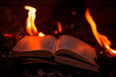 Background from burning books.Burning pages of books. Books on fire. Burning thoughts, news. Books...