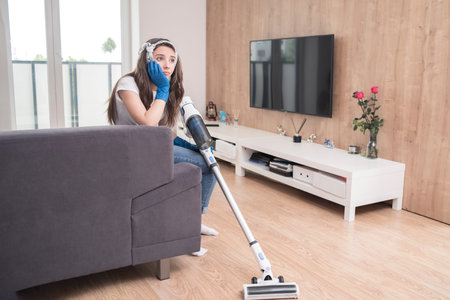 a vacuum cleaner.Girl cleaning 