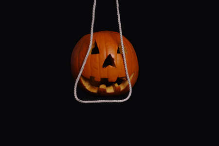 Halloween concept.Orange pumpkin for Halloween on a black background.の写真素材