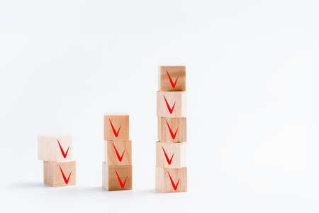 Cubes with voting icons on a white background, copy space, concept photo.の写真素材