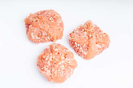 Raw chicken hamburger on a white background. Instant meat. Grilled hamburgers.Raw Hamburger, meatballs on white background.Fast food at home.Convenience food, precooked.の写真素材