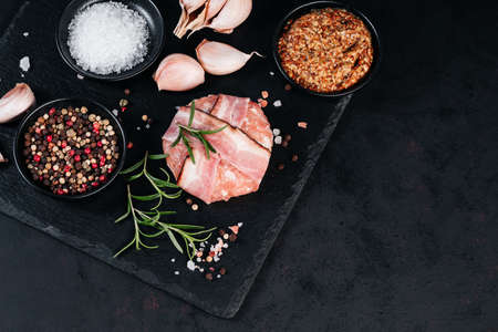 Grilled hamburgers.Copy space.Raw chicken burger with rosemary branch and spices. Instant meat.の写真素材