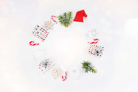 New Year gifts.Christmas and New Year background. Bright Winter holiday composition. Gifts, spruce branches, red decorations on a white background.Greeting card, banner, poster.Christmas composition.の写真素材