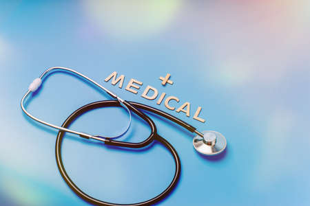 Doctor table with medical items on blue background. Flat lay.Medical science concept.Healthcare and medicine concept.の写真素材