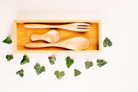 Utensils and devices made of natural materials.Plastic free concept.Set of eco friendly bamboo eating , wooden cutlery. Zero waste.Wooden cutlery for reusable use.Environmental protection concept.の写真素材