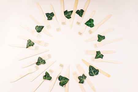 Wooden forks,spoons,zero waste.Copy space.Eco friendly wooden cutlery.Banner eco friendly disposable kitchenware utensils on white background.plastic free concept.Disposable wooden cutlery.Eco conceptの写真素材