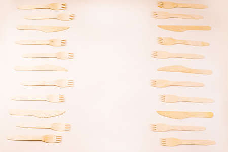 Wooden forks,spoons,zero waste.Copy space.Eco friendly wooden cutlery.Banner eco friendly disposable kitchenware utensils on white background.plastic free concept.Disposable wooden cutlery.Eco conceptの写真素材