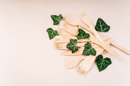Wooden forks,spoons,zero waste.Copy space.Eco friendly wooden cutlery.Banner eco friendly disposable...