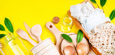 Recycling concept.Set of empty reusable,disposable eco-friendly plates, on yellow background.Ecological tableware made of natural materials.Life without Plastic.Eco friendly disposable tableware.の写真素材