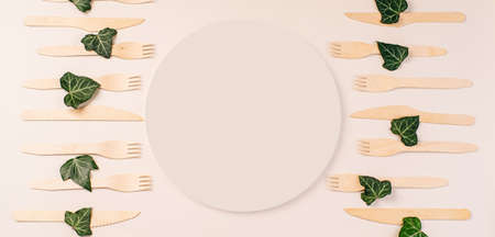 Wooden forks,spoons,zero waste.Copy space.Eco friendly wooden cutlery.Banner eco friendly disposable kitchenware utensils on white background.plastic free concept.Disposable wooden cutlery.Eco conceptの写真素材