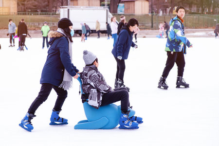 04.01.2022.Budapest.Family winter sport.Holiday and seasonal concept.Happy little boy and girl...