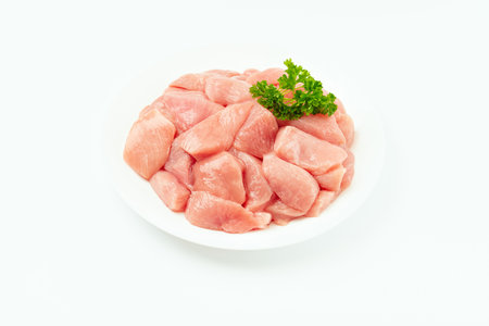 Fresh frozen pieces of turkey meat on a white background.Raw chicken.Frozen chicken fillet.Ogranic food and healthy eating.frozen turkey or poultry meat.Chicken Skewers breast fillet meatの写真素材