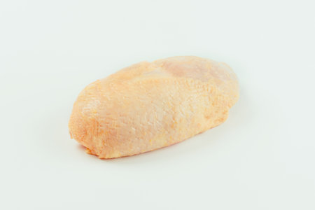 Food for retail.Chicken leg meat.Raw fresh chicken leg meat with skin on white background.Procurement for designers.Ogranic food,healthy eating.Food concept.Top view.Copy space.の写真素材