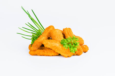 Chicken Breaded Fillet.Fast food. Breaded Chicken Inner Fillet on a White Background,Chicken Breaded Raw Meat. Fast cooking. Breaded chicken nuggets. Homemade food at home.の写真素材