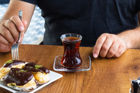 Turkish black tea with custard cakes. copyspace.
