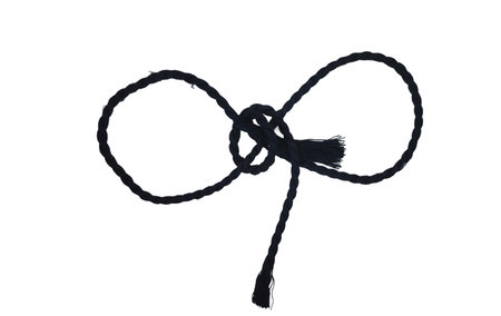 Black rope knot isolated on white background. Rope tied in a knot.の写真素材