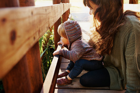 Shot of a single mother spending some time at the park with her sonの写真素材