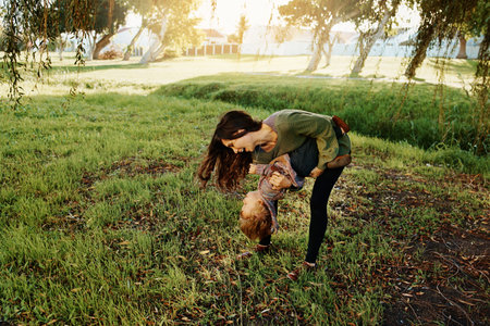Shot of a single mother spending some time at the park with her sonの写真素材