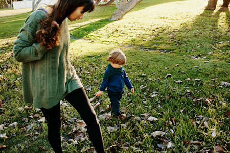Shot of a single mother spending some time at the park with her sonの写真素材