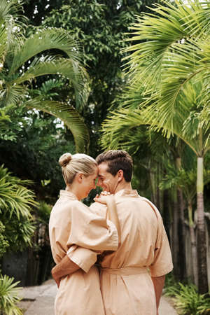 Shot of a young couple spending time together in the gardens at a day spaの写真素材