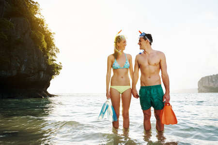 Shot of a young couple spending the day at the beachの写真素材