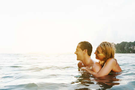 Shot of an affectionate couple spending the day at the beachの写真素材