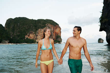 Shot of an affectionate couple spending the day at the beachの写真素材
