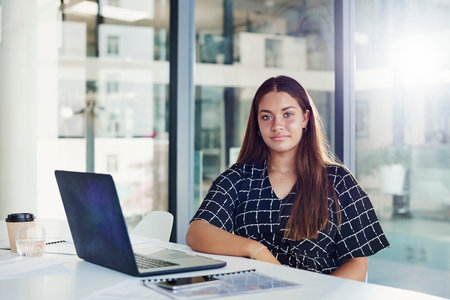 Portrait of a young businesswoman working in an office