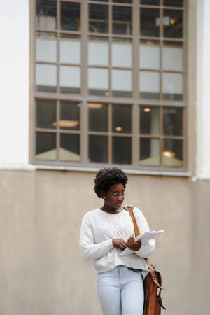 Shot of a female college student on campusの写真素材