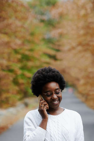 Shot of a young woman talking on her cellphone outsideの写真素材